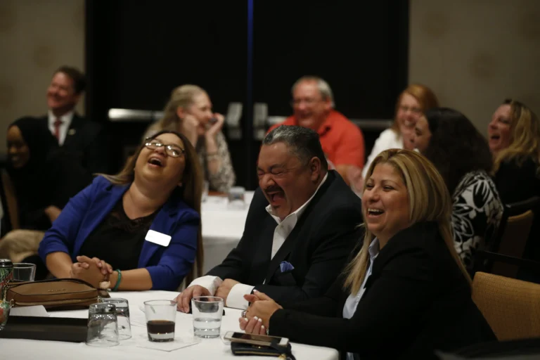 Woman laughing at entertainment