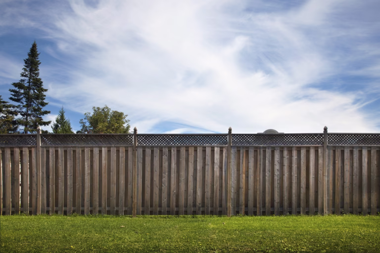 A wooden fence representing mental boundaries, inspired by Robert Frost’s “Mending Wall” and explored by motivational keynote speaker Tim Gabrielson.